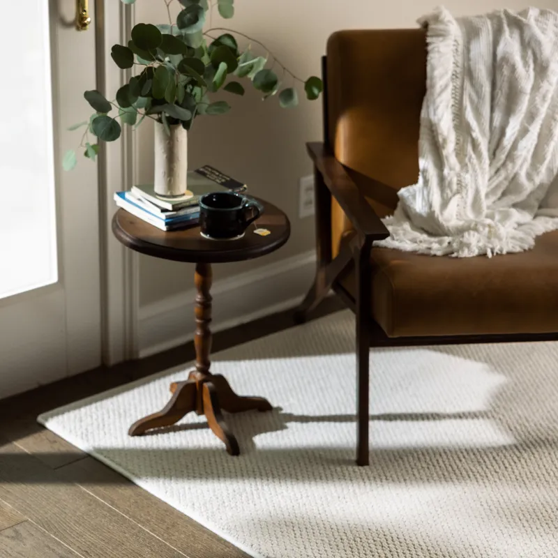 Carpet bound rug in sitting area | Pilot Floor Covering