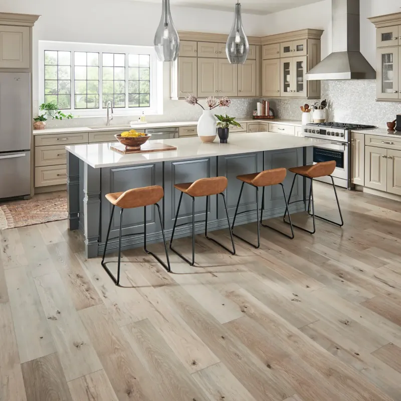 Laminate flooring in modern kitchen with two tone cabinets | Pilot Floor Covering